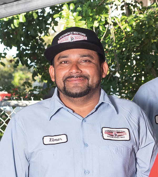 Elmer Paredes Smiling at the camera while in his work uniform